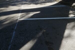 Crisp white bay lines on a re-lined tarmac car park
