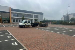 Numbered parking bays freshly marked in a business park car park