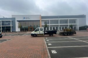 Completed car park line marking in front of an office building