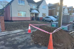 Driveway excavation fenced off before block paving