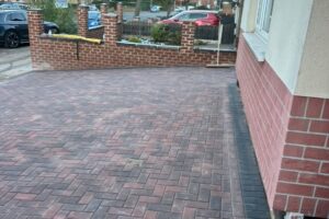 Finished block paving driveway with brick pillars