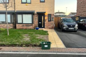Completed tarmac driveway and paved path at a new build house
