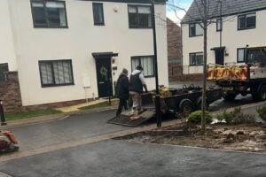 JJC Roadways team resurfacing a driveway with tarmac